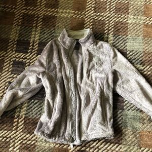 Grey fuzzy north face jacket